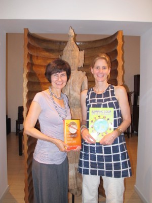 Authors sharing books: Kathryn Tonges with Susan Conley's 'The Foremost Good Fortune' and Susan with 'Slurping Soup'.