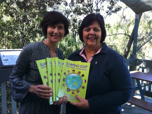 Supportive Gladstone Regional Council Mayor, Gail Sellers, with her 'Slurping Soup' purchases and co-author Kathryn Tonges.